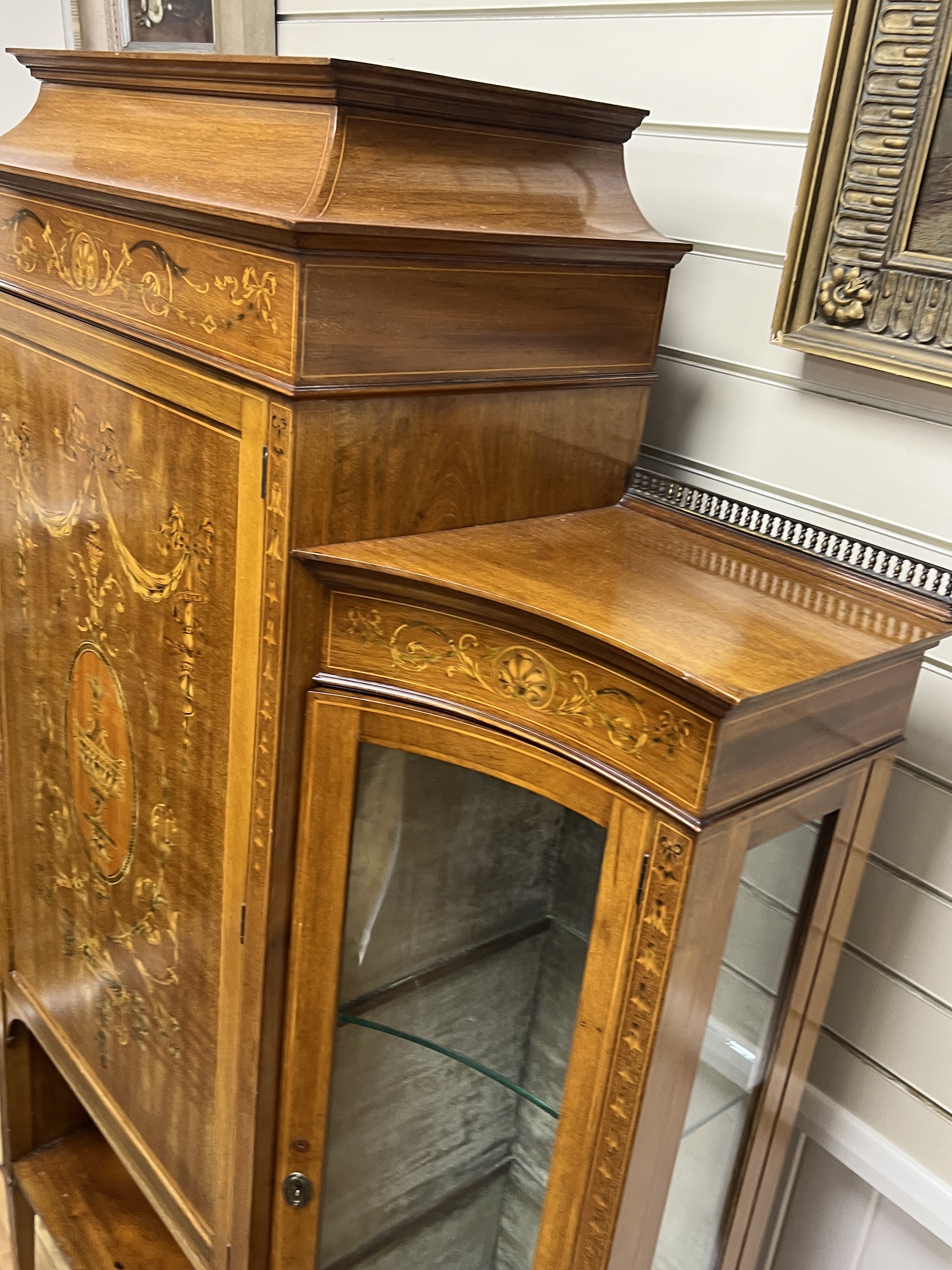 An Edwardian marquetry inlaid mahogany side cabinet, width 172cm, depth 38cm, height 177cm